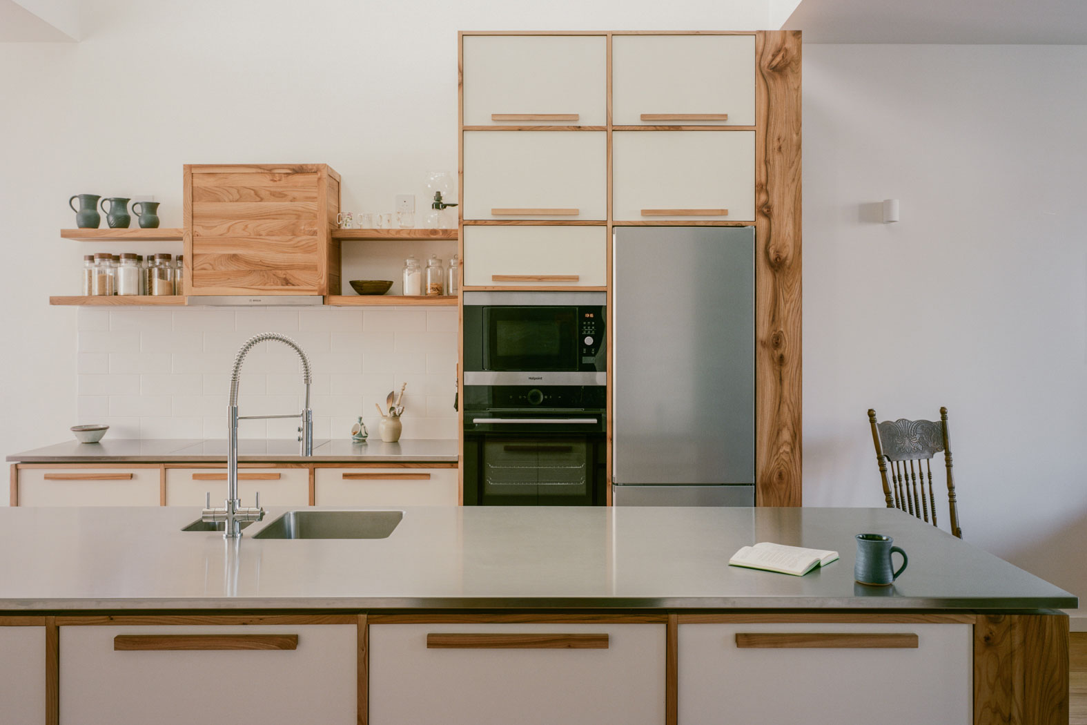 A Bespoke light fitting completes the look and adds to the definition of the space.
