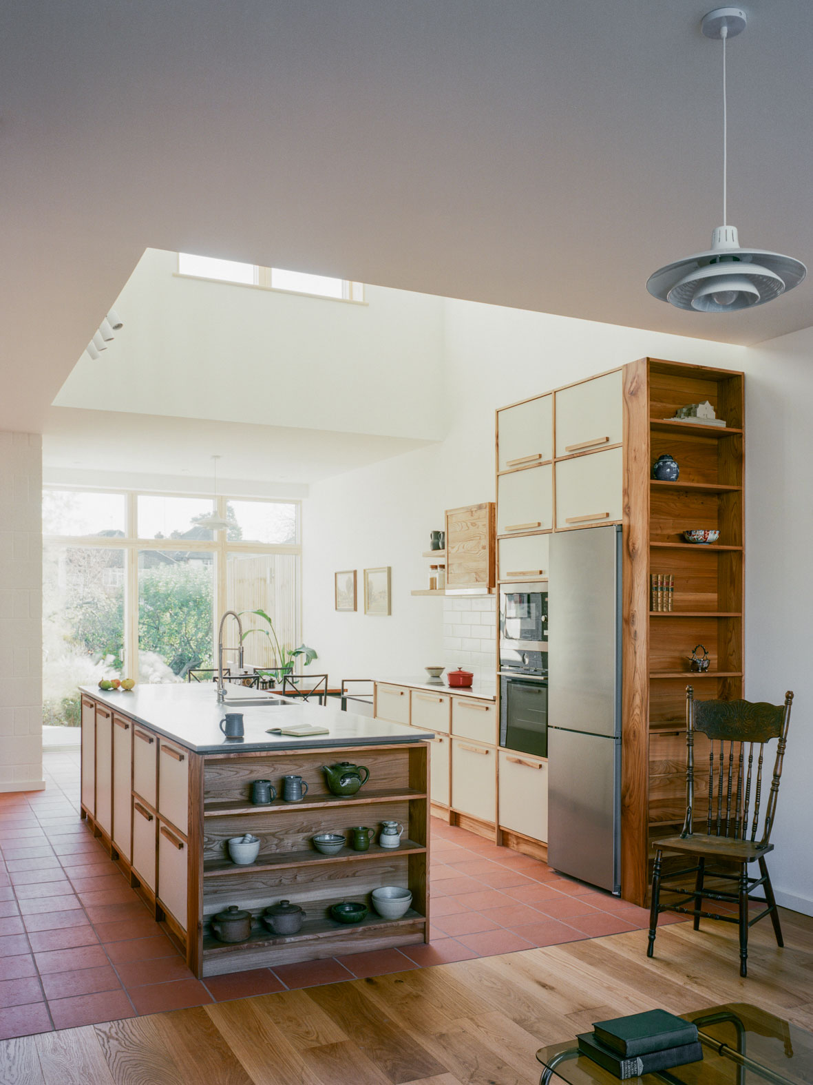 Leaning into the utilitarian brief for this kitchen, we used Dexion slotted angle for the framework and added warmth with Aspen veneered ply. Stainless steel counter tops and splashbacks complete the functional, industrial feel.