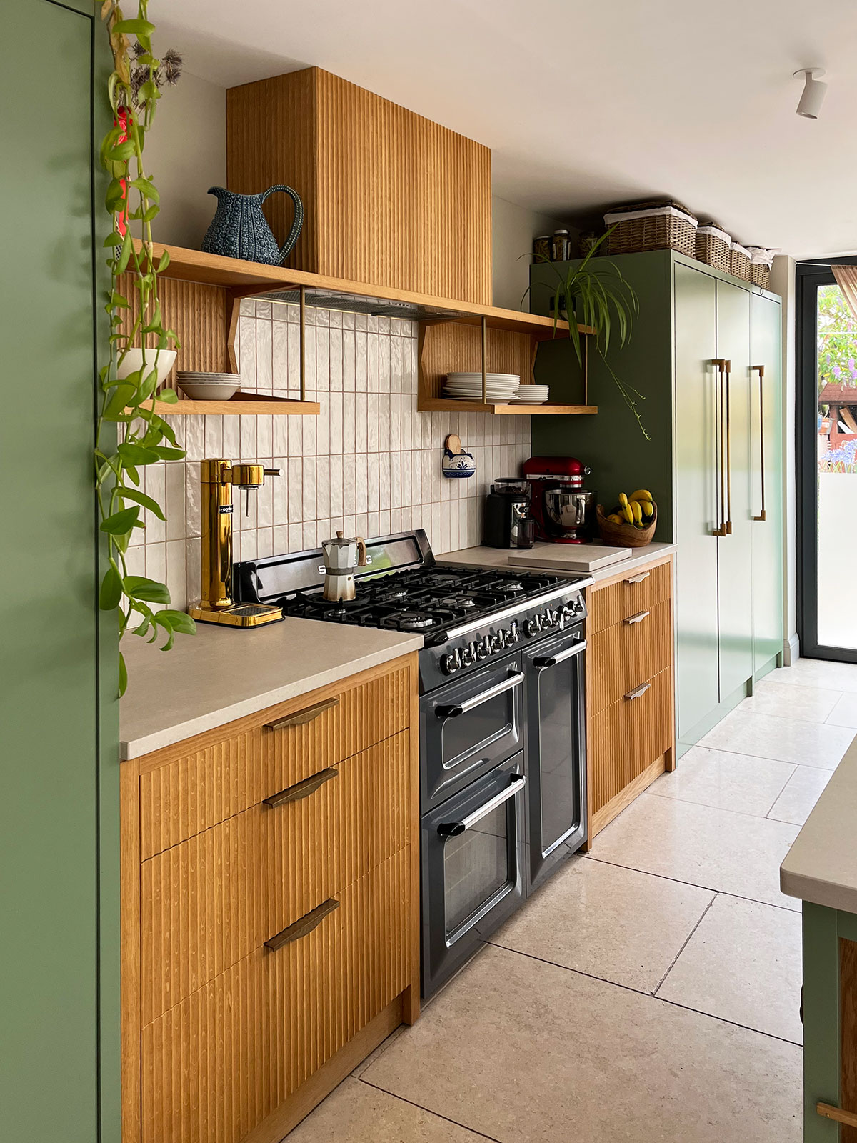 Overview of kitchen in Bighton with Oak fluted drawer fronts with bespoke handles.