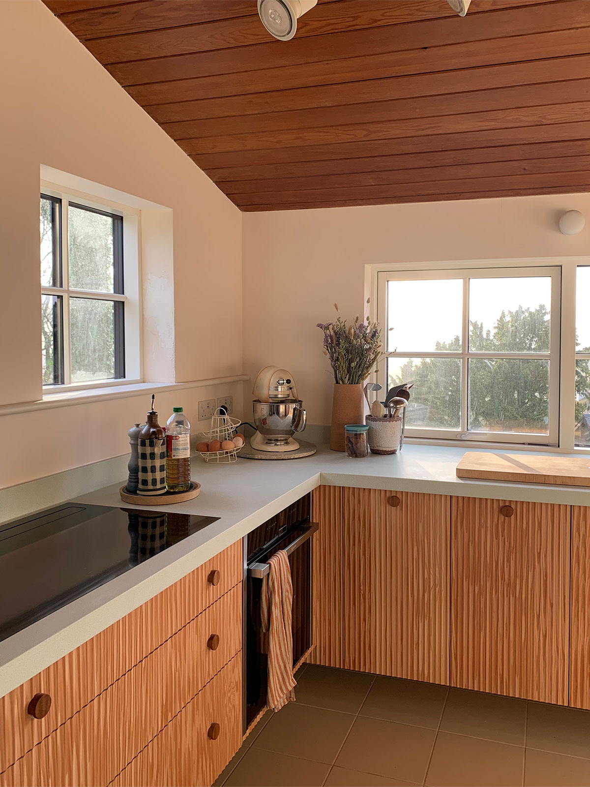 Douglas Fir is used throughout this Peak District kitchen in all cabinets. Worktops are mint Durat.