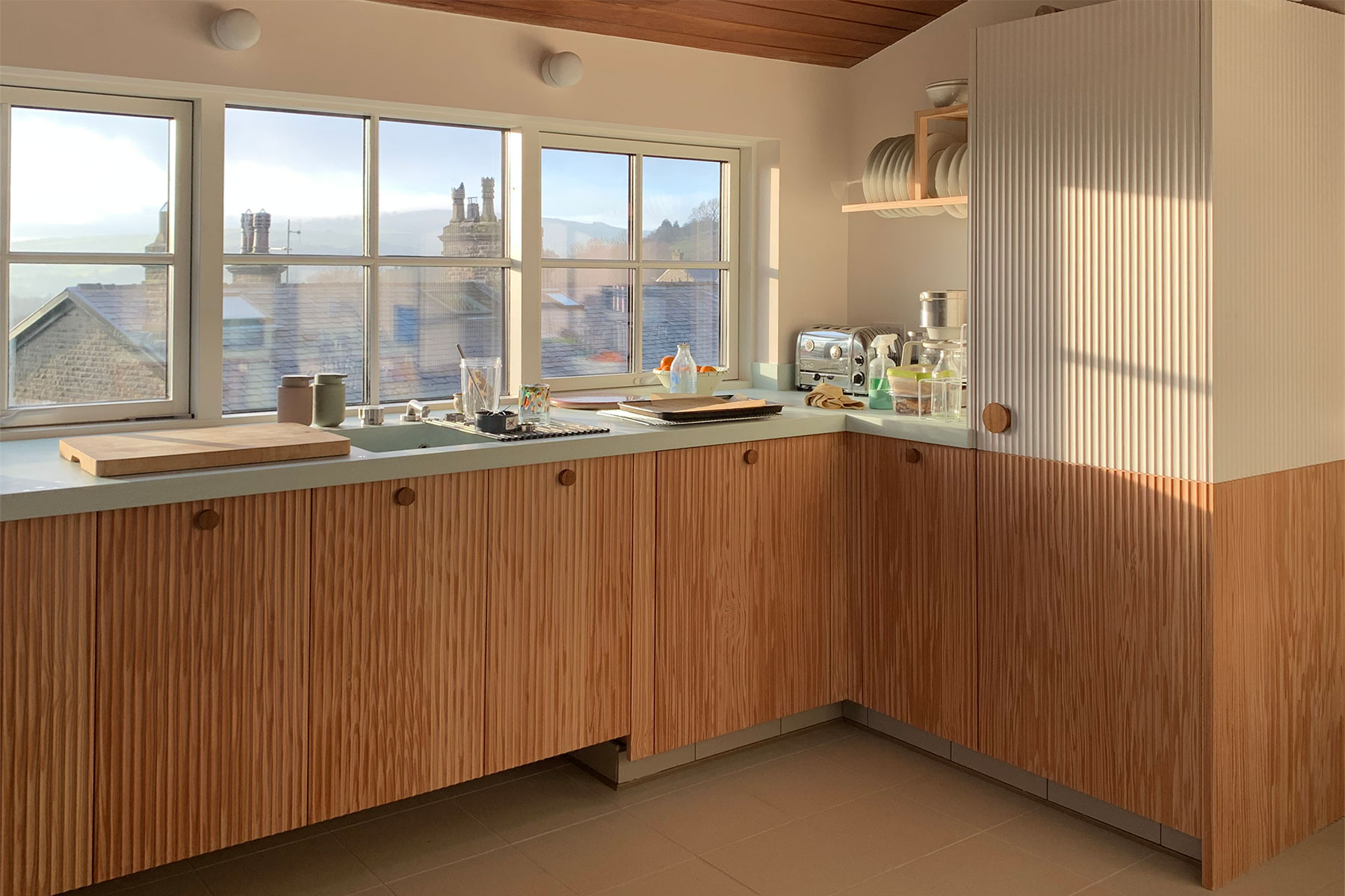 With the kitchen looking across the Derbyshire countryside, floating cabinets were used to accentuate rather than detract from the view.