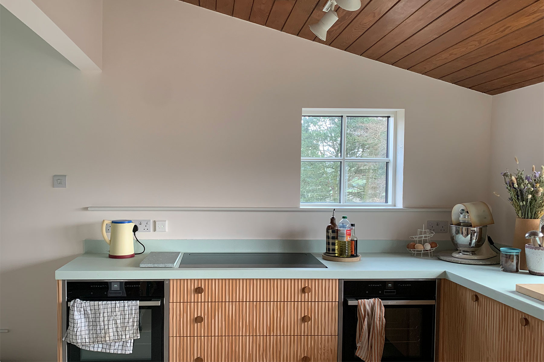 The mint Durat countertops invite the outside in.