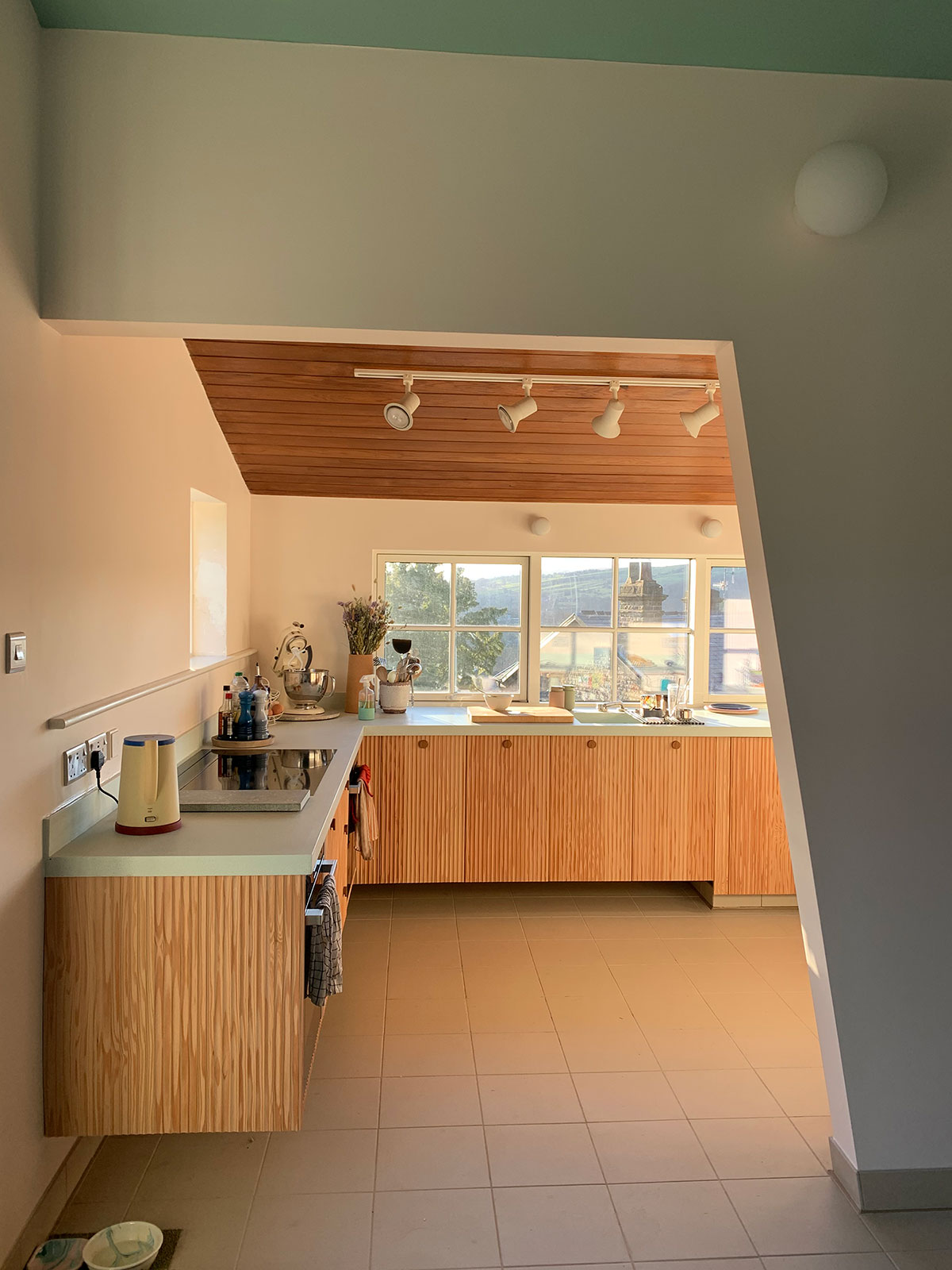 Warm light hits the Derbyshire kitchen in thsi overview of the space.