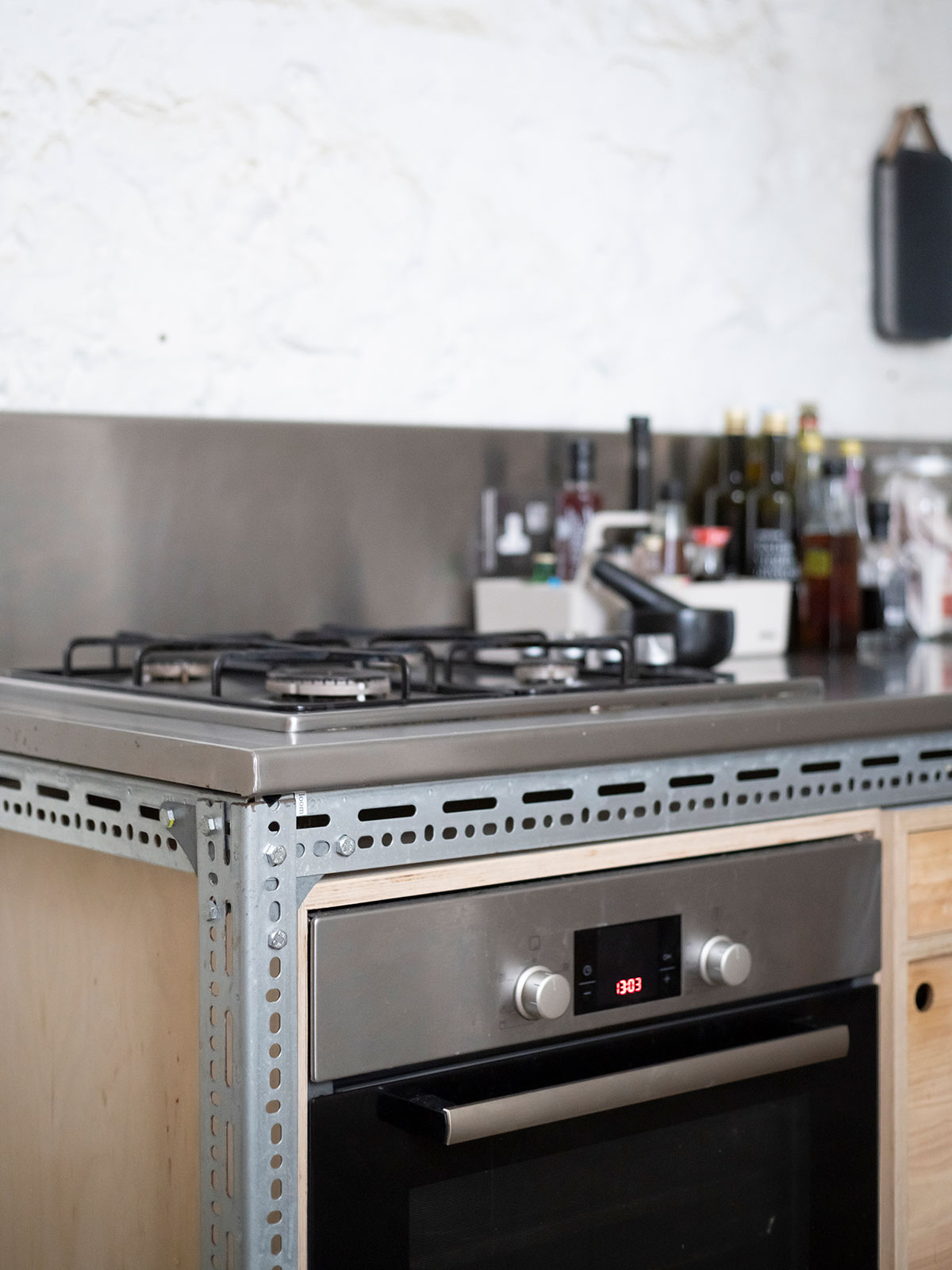 Stainless steel hob above the corner oven.