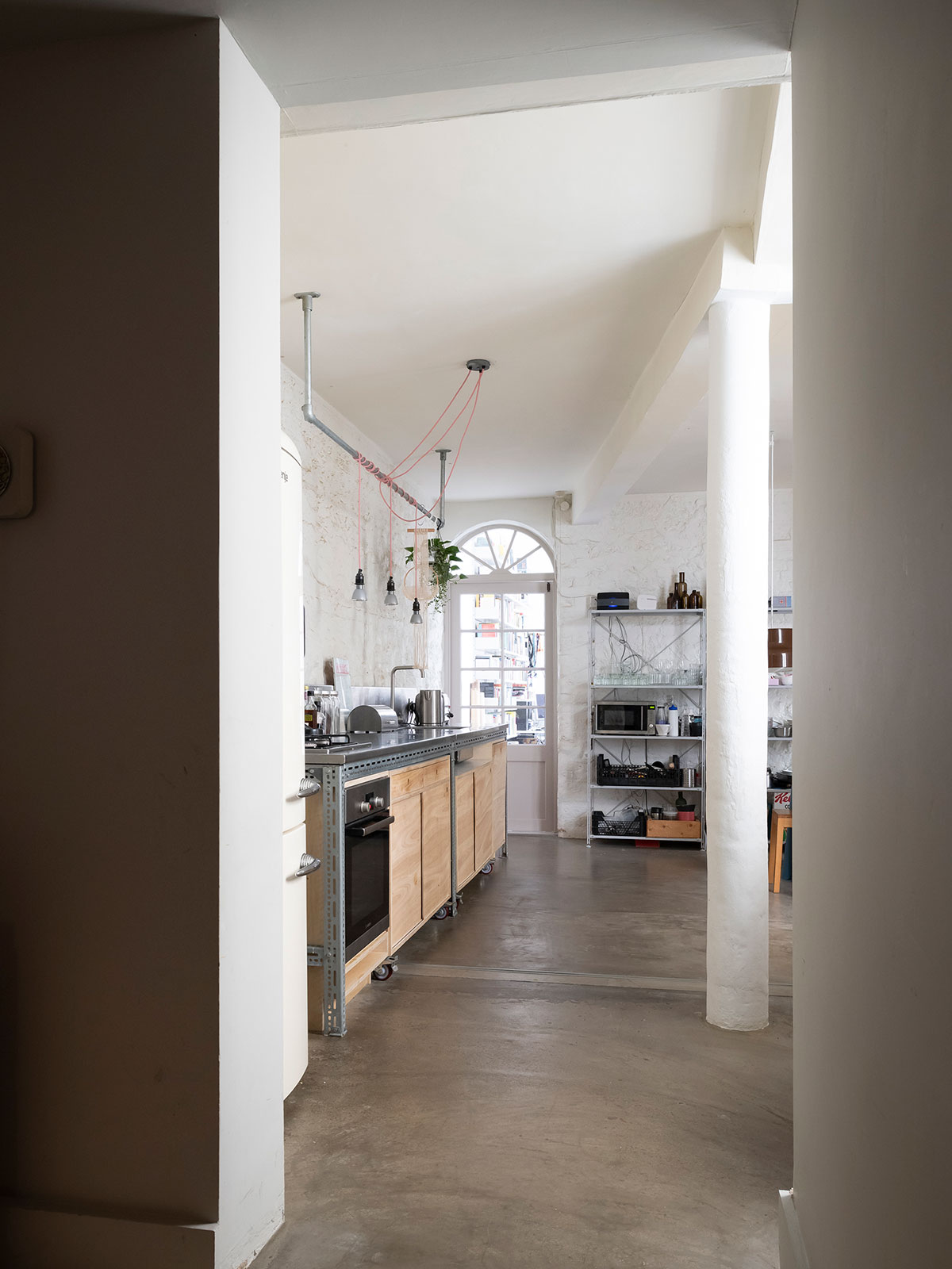 The clients had already prepared the kitchen space with painted exposed bricks and polished concrete floors, allowing them to visualise their ideal kitchen.