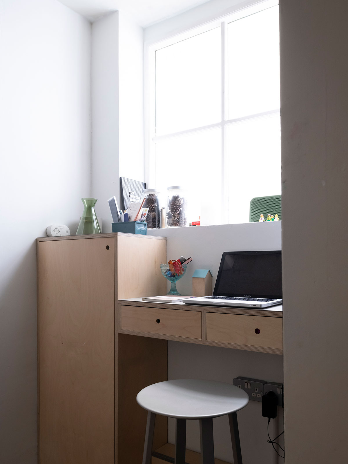 A custom desk/storage area adds practicality to a previously under-utilised area.