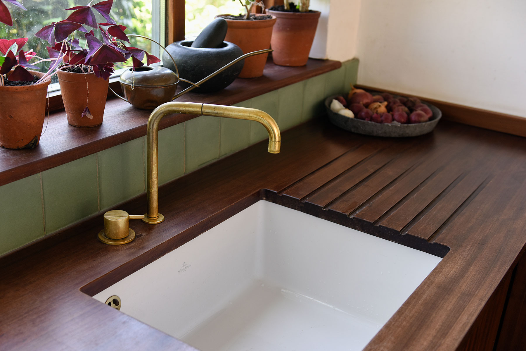 The worktops here are crafted form reclaimed science laboratory counter tops, the existing patina helping to creating a timeless space reflective of the building’s heritage.