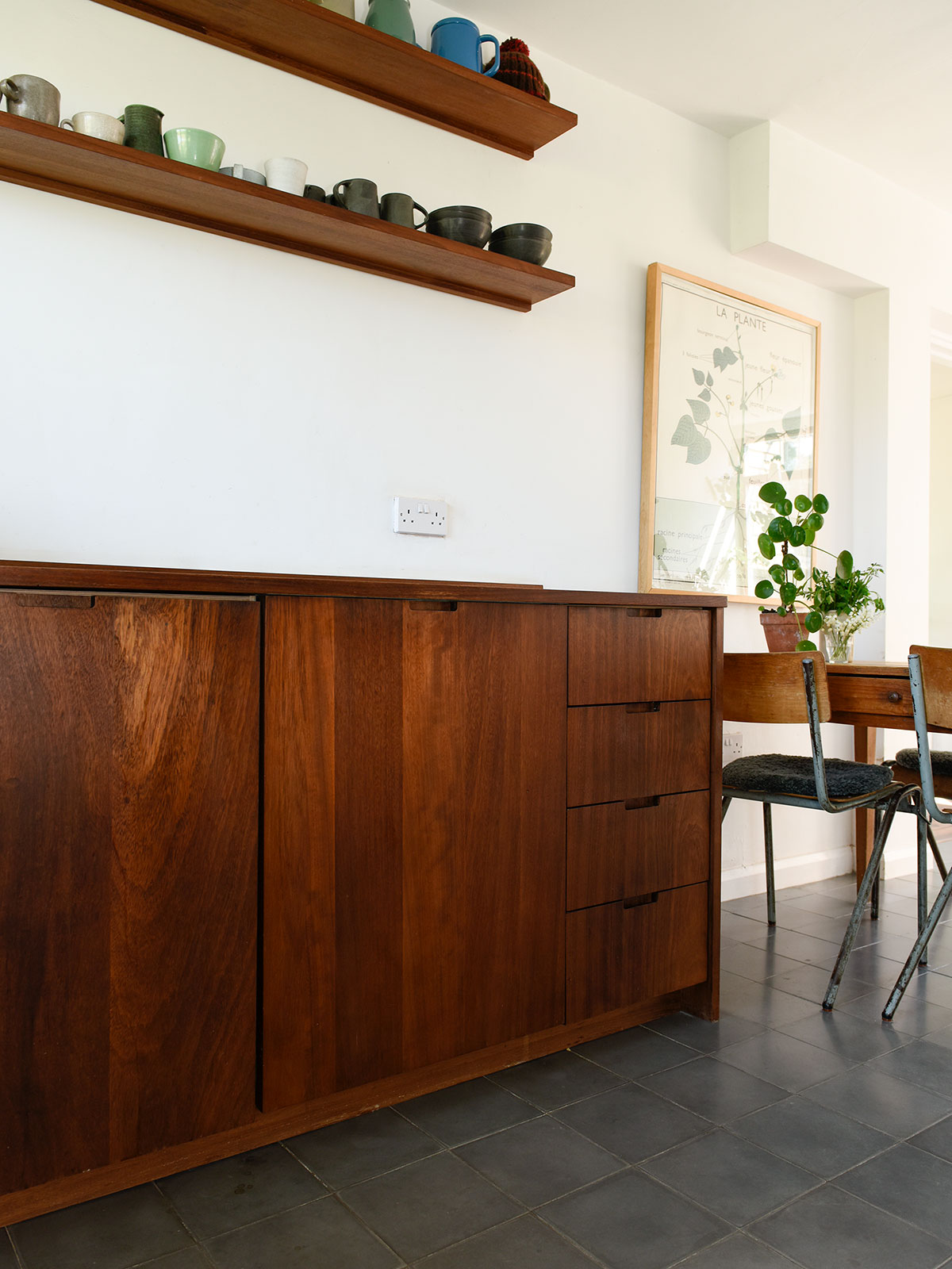 simple stylish shelving adds aestheticly pleasing and practical storage.