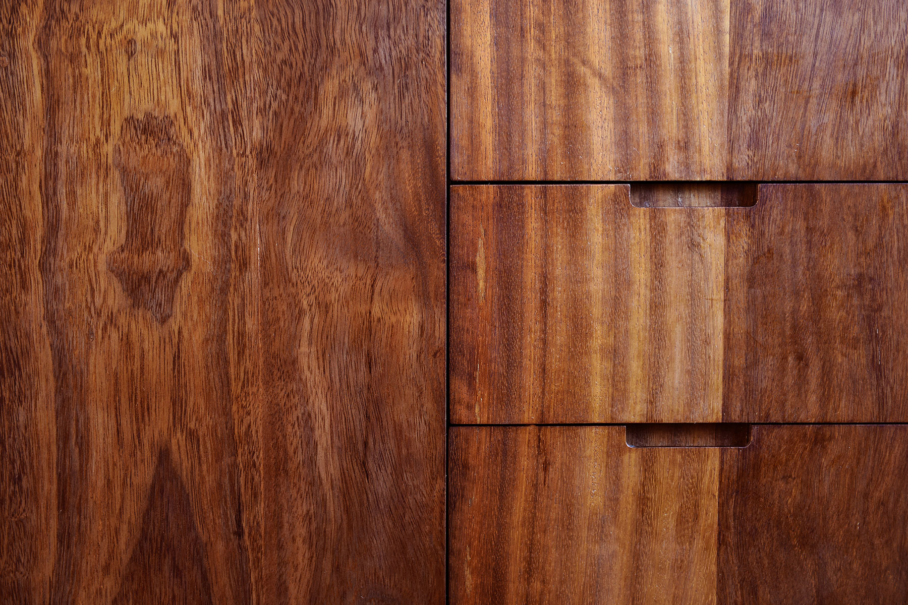 Kitchen cabinet and drawer fronts crafted from reclaimed wood from a science lab.