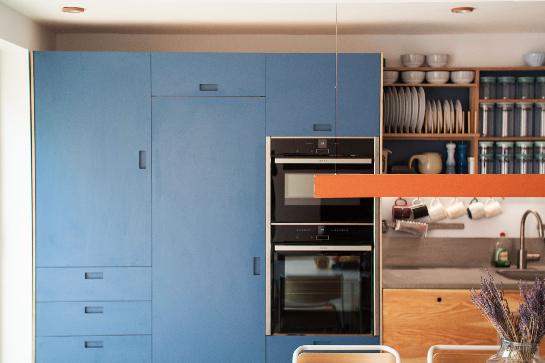 A Bespoke light fitting completes the look and adds to the definition of the space.