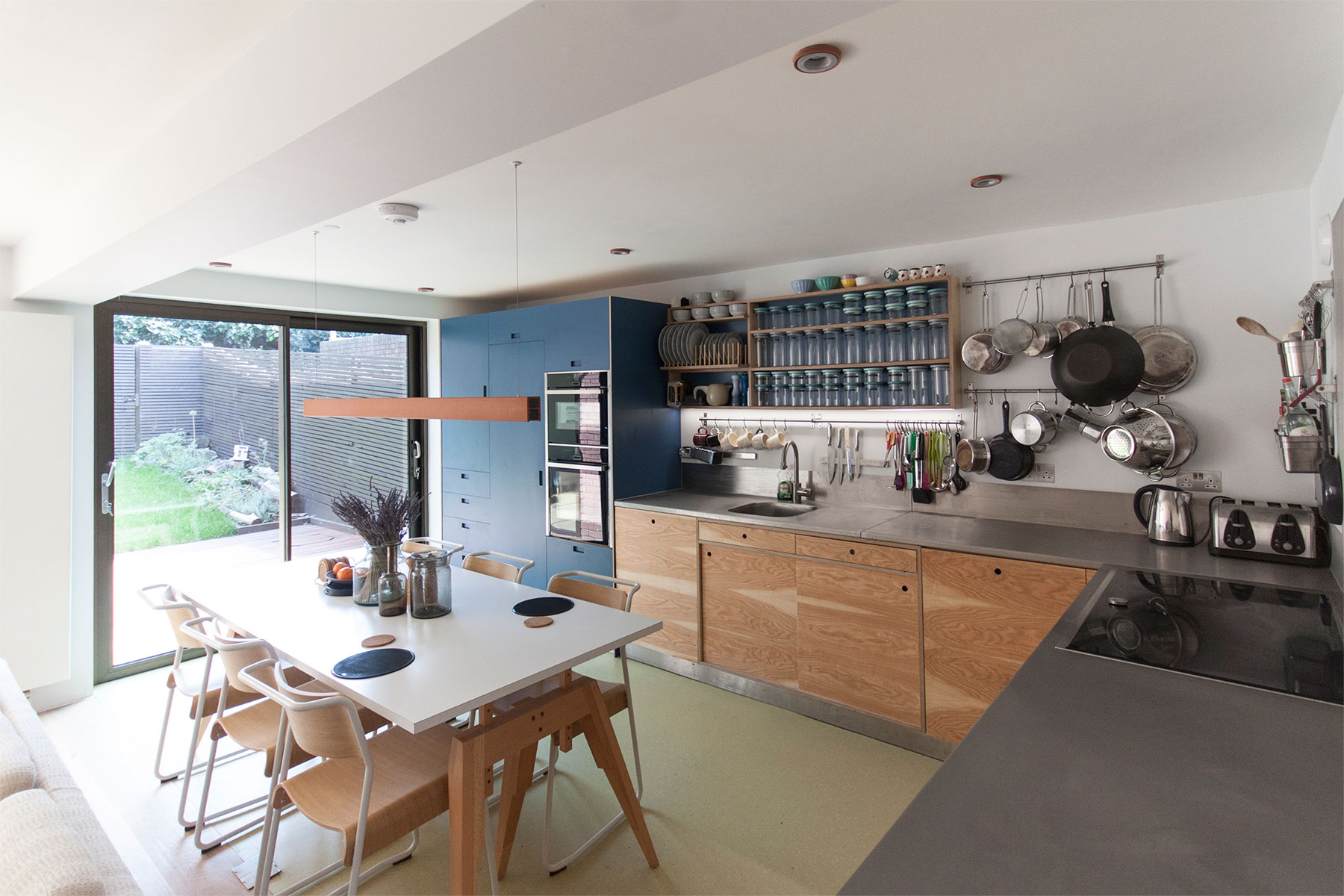 The kitchen of this light and bright open-plan area was distinguished with the use of sympathetic and functional materials, including Formica, linoleum, Aspen ply and stainless steel.